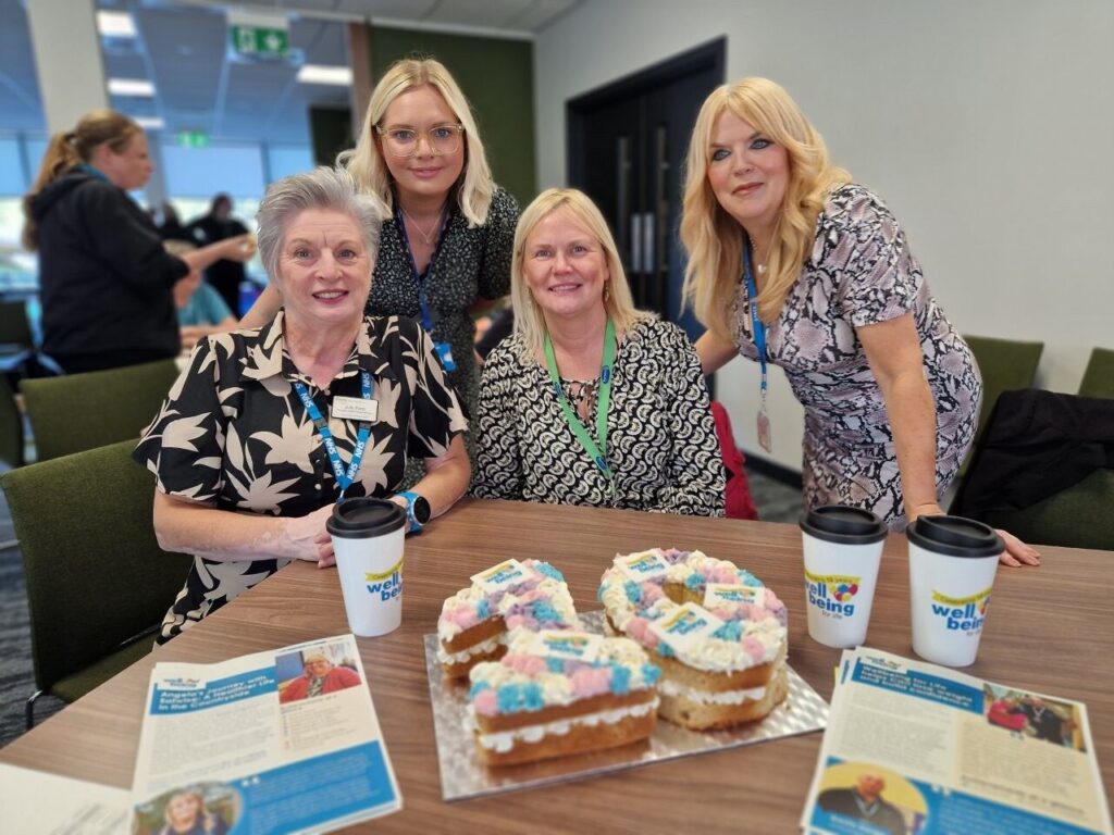 WBFL Programme Lead (2015-2025) and WBFL Commissioners with a "10" celebration cake.