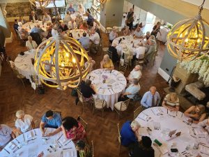 Large gathering of veterans and families at a dinner event